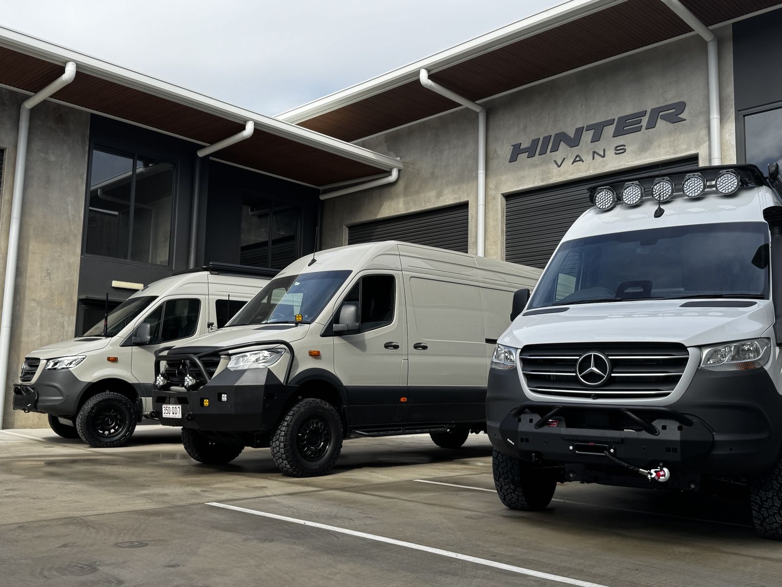 Three Hinter Vans Sprinters parked outside the Hinter Vans workshop