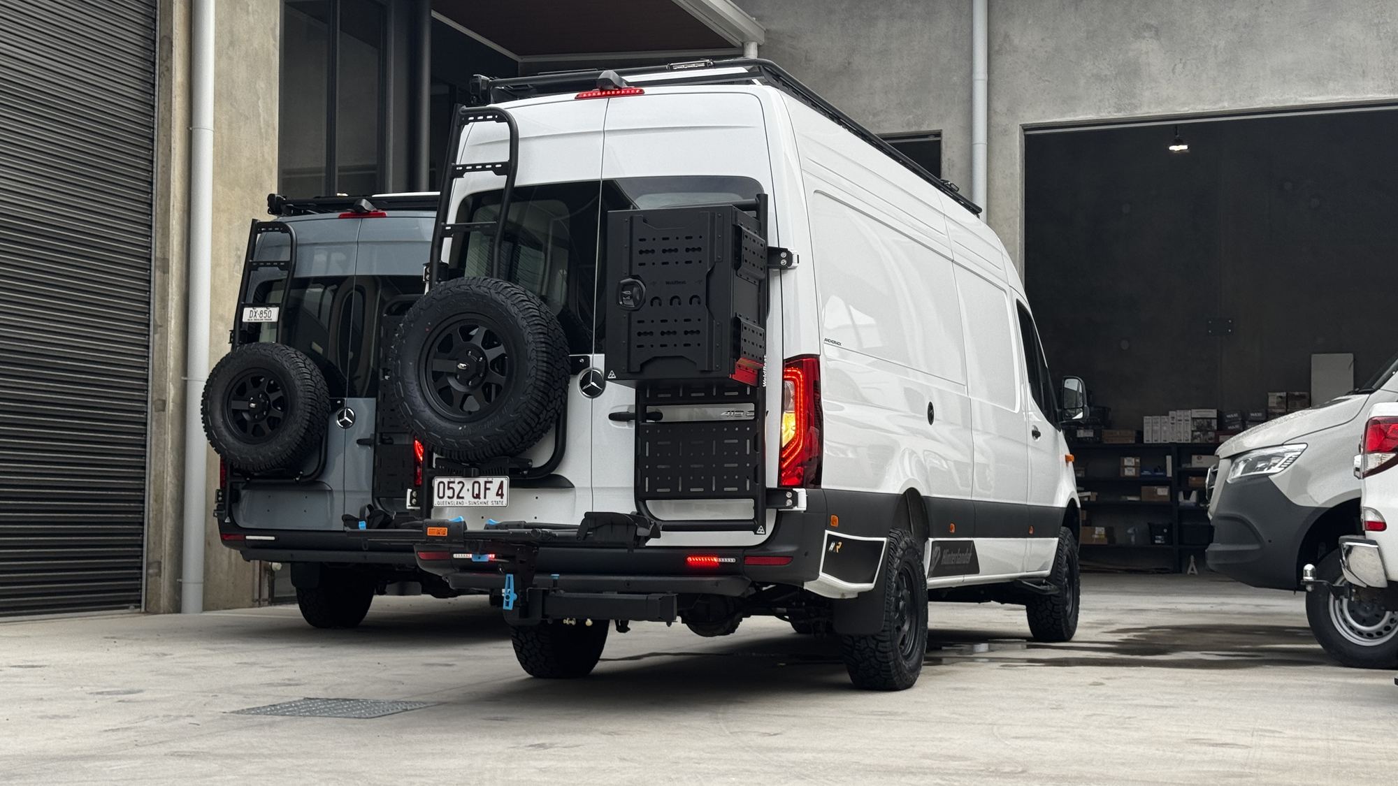 Two finished Hinter Vans outside the workshop